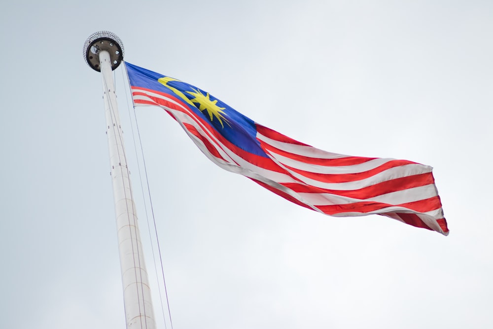 The Malaysian flag, Jalur Gemilang, flying against the sky