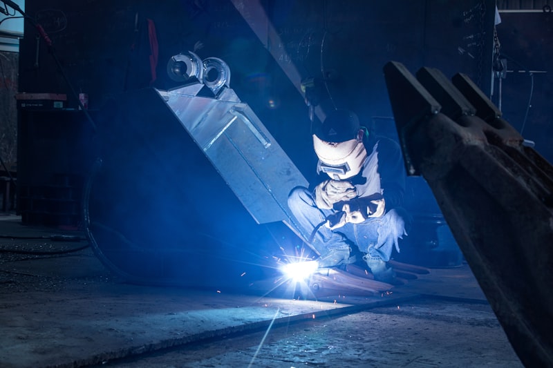 Engineer welding in an industrial workshop