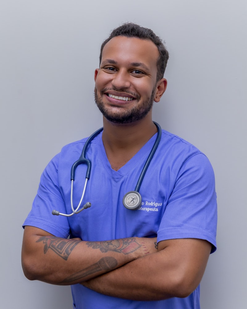 Smiling healthcare worker in scrubs with a stethoscope